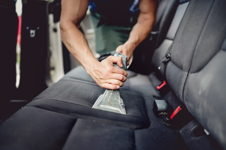 vacuuming car interior