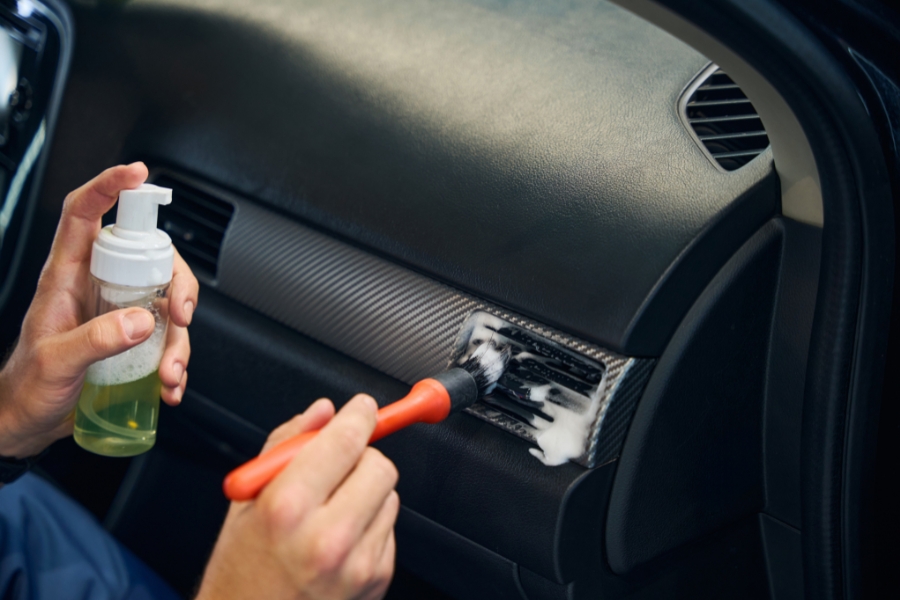 car detailer cleaning air vents